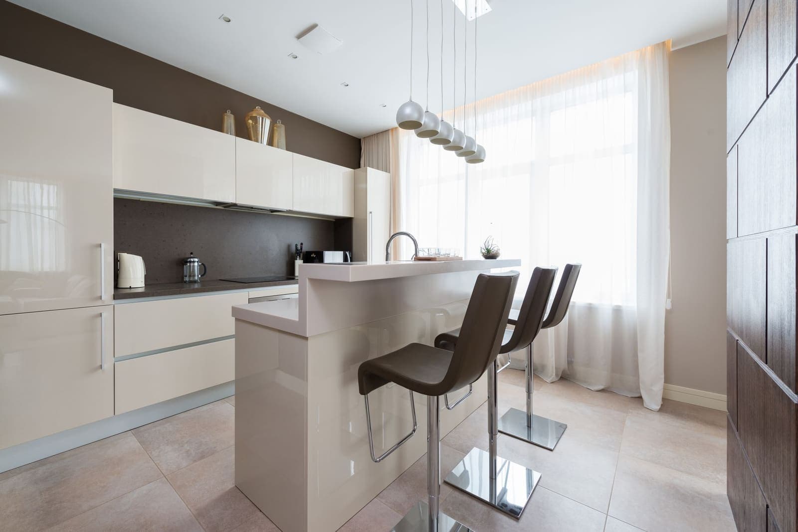 Bar chairs at a kitchen island counter
