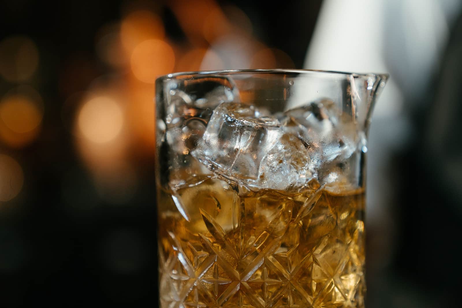A cut-glass Yarai mixing glass filled with clear ice